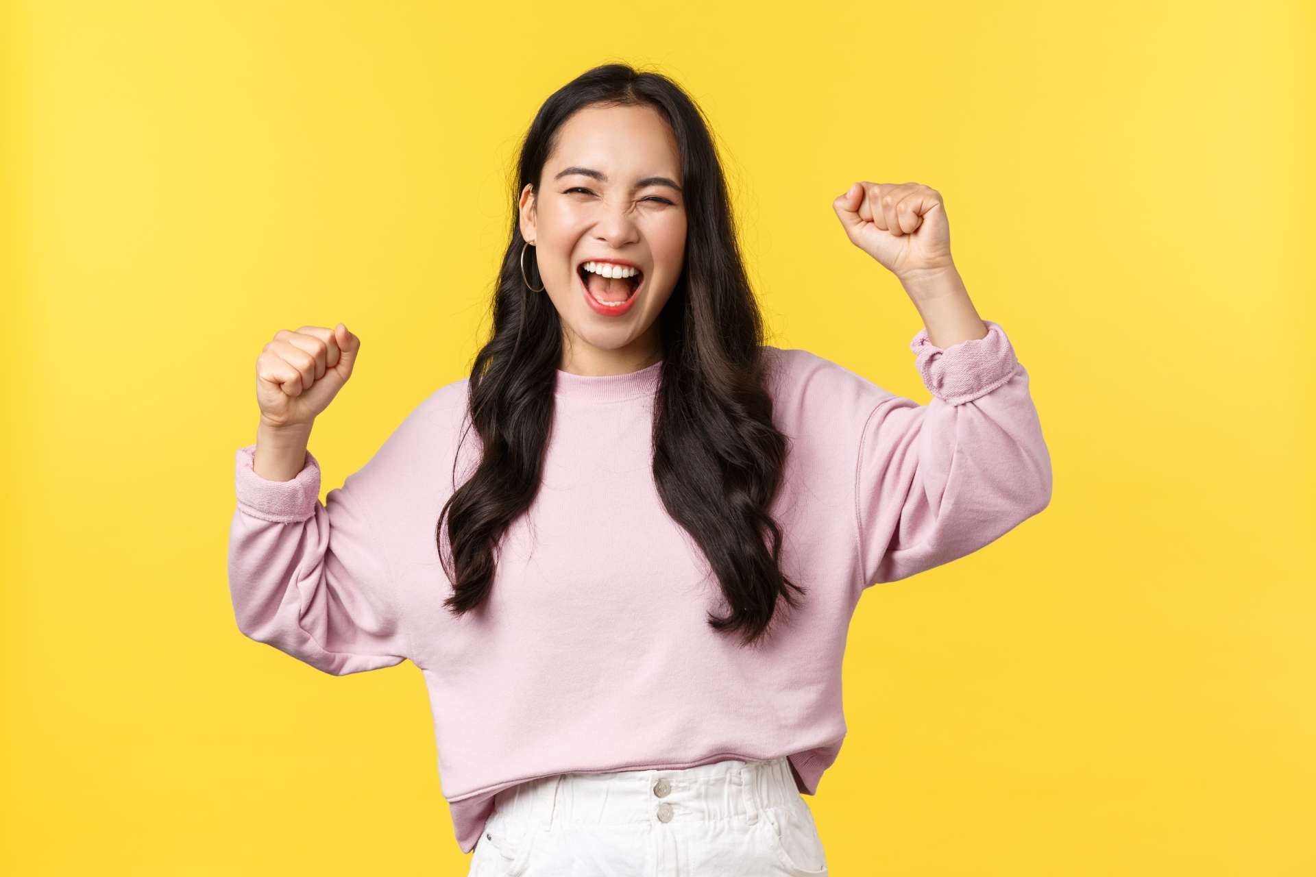 lifestyle-emotions-and-advertisement-concept-happy-smiling-and-pumped-asian-girl-celebrating-victory-chanting-yes-with-hands-raised-up-and-broad-grin-triumphing-over-achievement-or-success.jpg